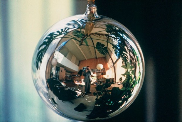 Self-portrait in Christmas ornament (ca. 1950s) by Charles Eames