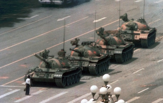 An anonymous man confronting a column on Chinese tanks in Beijing, on June 5, 1989. Photo by Jeff Widener 