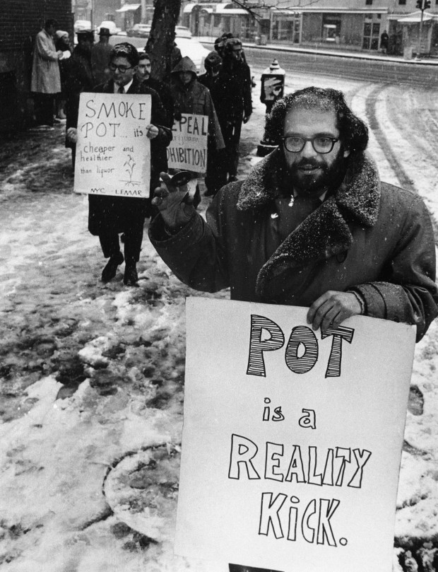 Photographer unknown. Allen Ginsberg holding a sign that reads: “Pot is a Reality Kick”. Maybe from Dec. 27, 1964. Large format retrieved from Imgur.