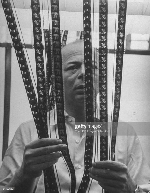 “Movie director Billy Wilder standing behind strips of film in cutting room while he decides which should go into finished movie.” Photo by Bob Landry. Image retrieved from Getty Images.